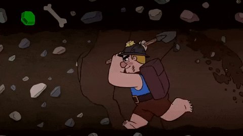 Górnik kopiący przejście w tunelu